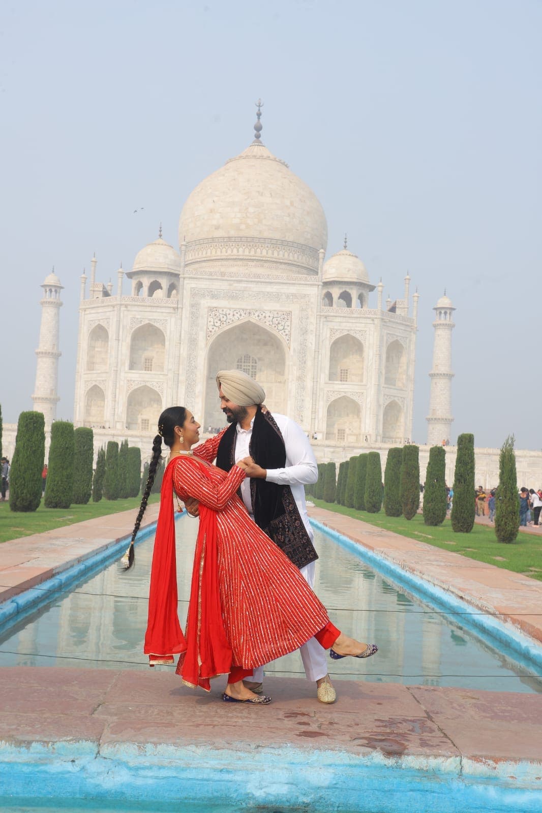 The Taj Mahal softened by early morning mist above the gardens